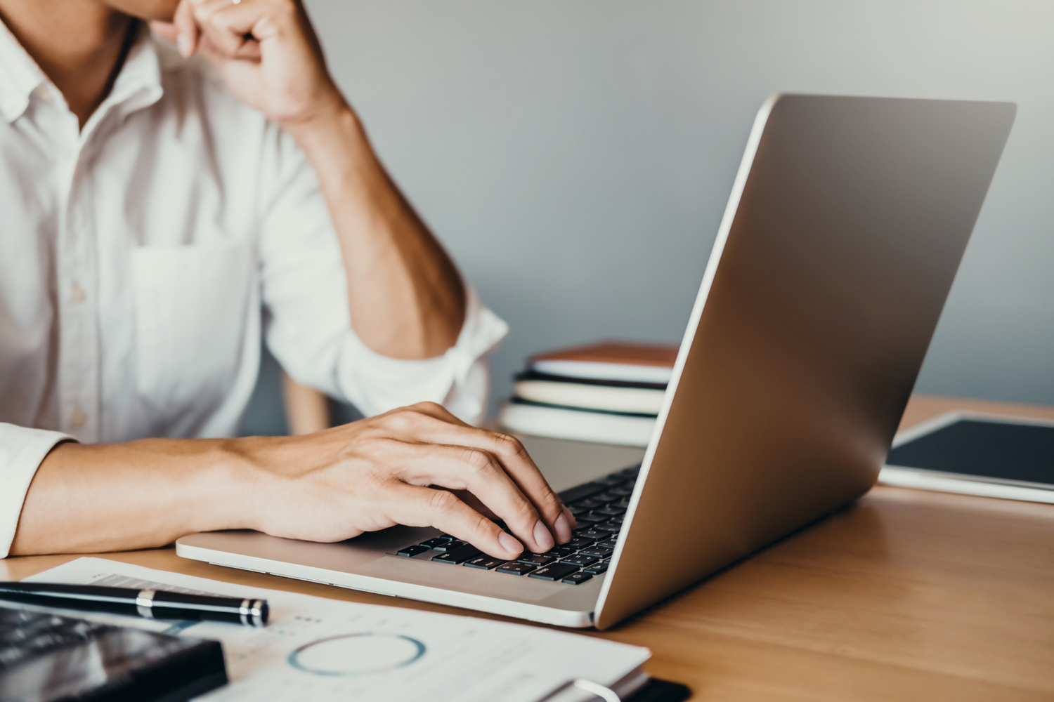 Business person using computer to trade mutual funds